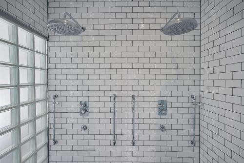 a row of urinals in a bathroom at Hotel du Vin Birmingham in Birmingham