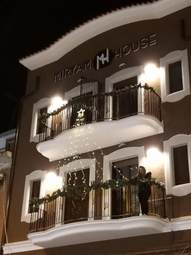 a man standing on a balcony of a building at Miryam House Affittacamere Suite e Relax in San Severo