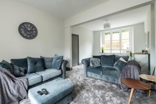 a living room with a couch and a table at North Lodge in Lancaster