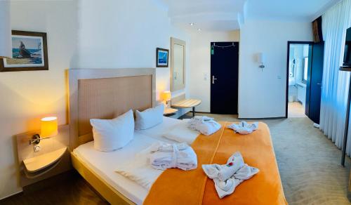 Кровать или кровати в номере Aparthotel Kleine Perle