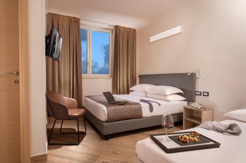 Postel nebo postele na pokoji v ubytování Simon Hotel
