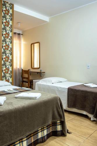 Ένα ή περισσότερα κρεβάτια σε δωμάτιο στο Hotel Pousada Icaraí