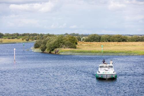a small boat in a large body of water at Tullamore Court Hotel in Tullamore