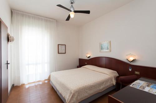 Posteľ alebo postele v izbe v ubytovaní Hotel Arborea