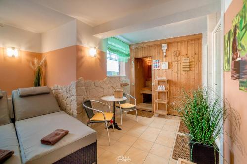 a living room with a couch and a table at Haus Isabella Obertauern in Obertauern