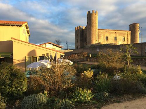 a castle with two towers on top of a building at Ess'folie Gîte in Chambles