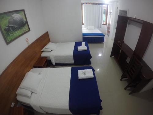 Postel nebo postele na pokoji v ubytování Hotel LA GRAN TORTUGA - ᯤ STARLINK