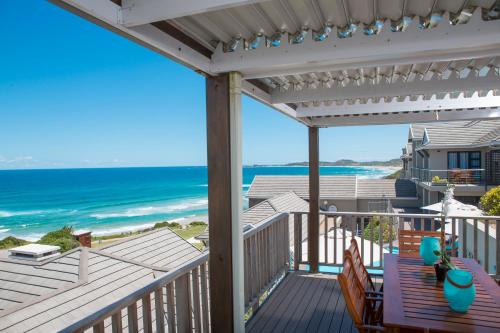 a balcony with a view of the ocean at Brenton Haven Beachfront Resort in Knysna