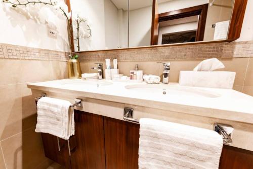 A bathroom at FIRST CLASS 3BR with full BURJ KHALIFA VIEW