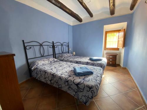 Cama o camas de una habitación en Casa Rural La Fàbrega