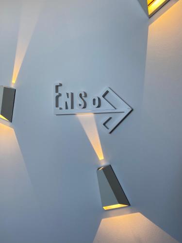 a street sign with an exit arrow in a room at Absolute Mykonos Suites & More in Mikonos
