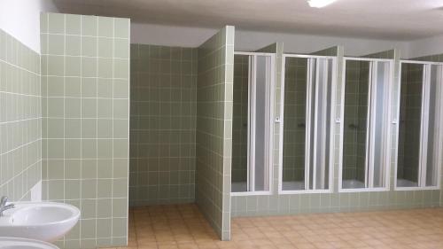 a bathroom with a sink and a mirror at Retro Kemp pod Boubínem in Horní Vltavice