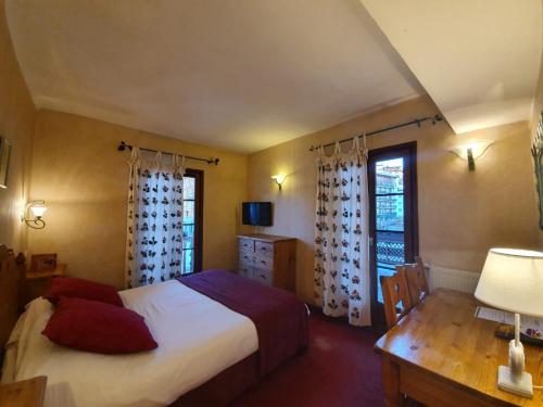 Katil atau katil-katil dalam bilik di Le Chalet Suisse