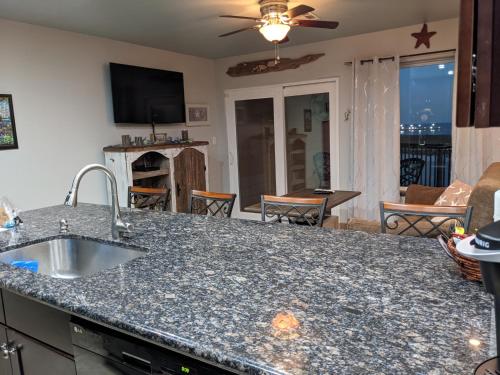 a kitchen and living room with a counter top at Gulf View, Flip Flop Oasis GVR06432 in Galveston