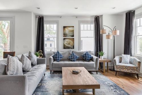 a living room with a couch and a table at Brand New Luxury Home near Downtown in Nashville