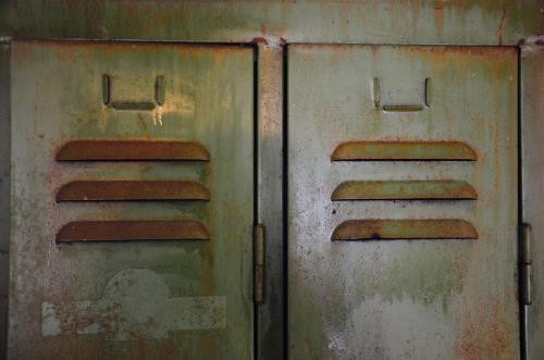 two rusty metal doors with a symbol on them at BE41 Boutique Hotel in Maastricht