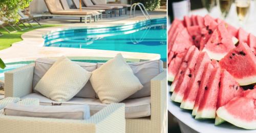 a table with slices of watermelon on it next to a pool at Es Baulo Petit Hotel in Can Picafort