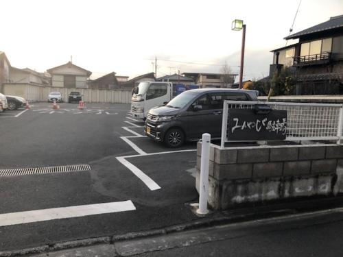 a parking lot with cars parked in it at Comfort stay Miyabi in Chichibu