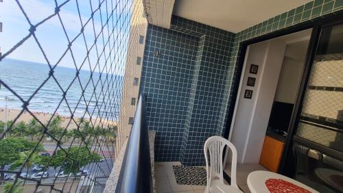 a balcony with a view of the ocean at Paraíso do Sul Recife in Recife