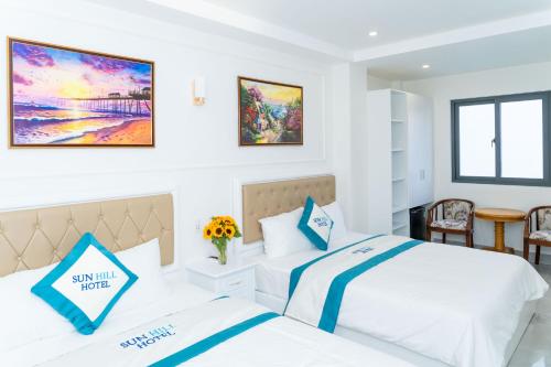 Postel nebo postele na pokoji v ubytování Sun Hill Hotel