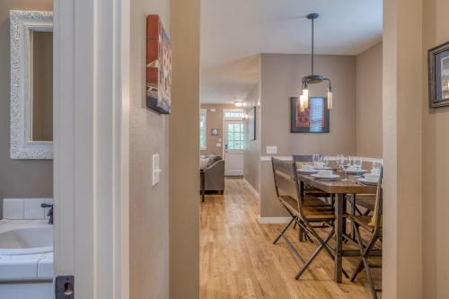 a dining room and kitchen with a table and a bathroom at Coastal Bliss in Lincoln City