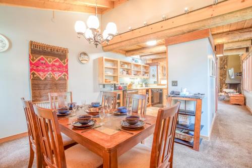 a kitchen and dining room with a wooden table and chairs at Wildflower 46 - Meredith Lodging in Sunriver