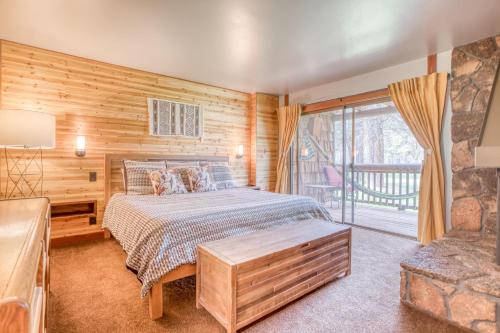 a bedroom with a bed and a large window at Wildflower 46 - Meredith Lodging in Sunriver