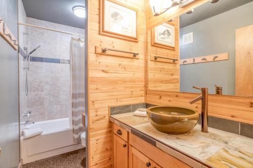 a bathroom with a sink and a shower at Wildflower 46 - Meredith Lodging in Sunriver