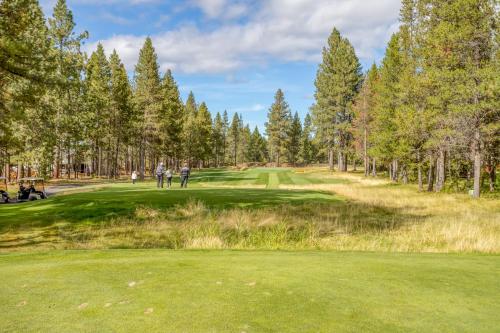 a view of a golf course with people on the green at Wildflower 46 - Meredith Lodging in Sunriver