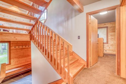 a staircase in a house with wooden walls and ceilings at Wildflower 46 - Meredith Lodging in Sunriver