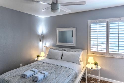 a bedroom with a bed with two towels on it at Vegas Vacation in Las Vegas