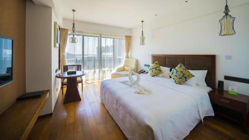 Ένα ή περισσότερα κρεβάτια σε δωμάτιο στο Wyndham Garden Lingshui
