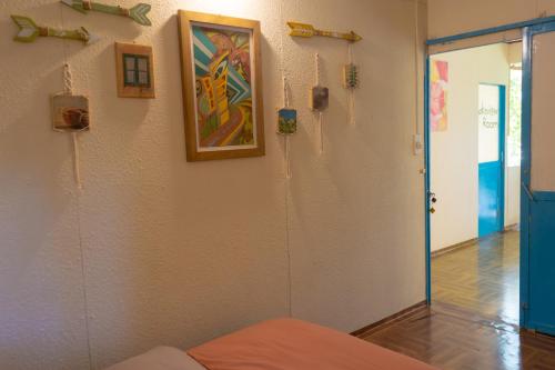 a room with a painting on the wall and a bed at The Lake House Dalat in Da Lat