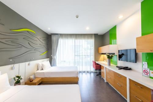 Ένα ή περισσότερα κρεβάτια σε δωμάτιο στο Paeva Luxury Serviced Residence SHA