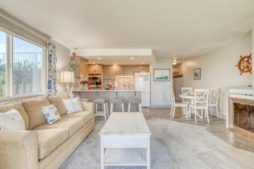 a living room and kitchen with a couch and a table at Dock of the Bay 108 in Lincoln City