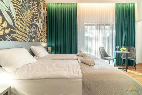 Ένα ή περισσότερα κρεβάτια σε δωμάτιο στο Villa Solaris