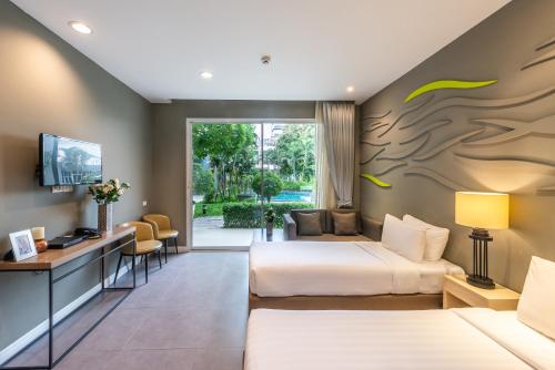 Ένα ή περισσότερα κρεβάτια σε δωμάτιο στο Paeva Luxury Serviced Residence SHA