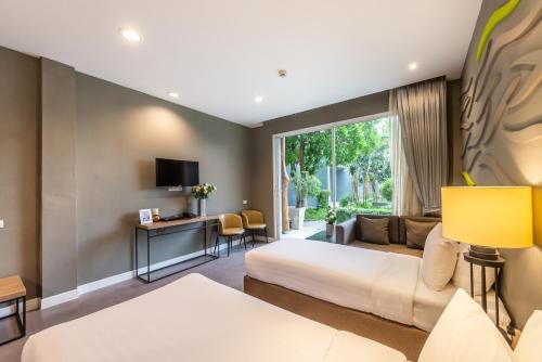 Ένα ή περισσότερα κρεβάτια σε δωμάτιο στο Paeva Luxury Serviced Residence SHA