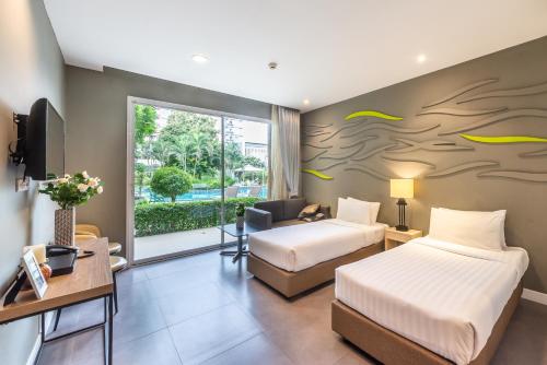 Ένα ή περισσότερα κρεβάτια σε δωμάτιο στο Paeva Luxury Serviced Residence SHA