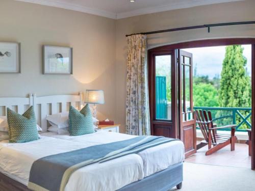 a bedroom with a bed and a sliding glass door at Oliver`s in White River