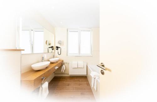 Koupelna v ubytování Maingau Hotel