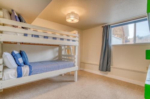a bedroom with bunk beds and a window at Netarts Coastal Retreat - Meredith Lodging in Tillamook