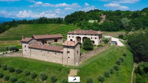 an aerial view of a castle on a hill at Agriturismo Ronchi Di Sant'Egidio in Manzano