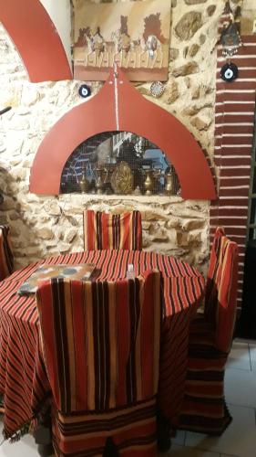 a bedroom with a bed and a stone wall at Marie-Claire la grillade in Briare