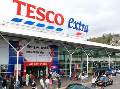 a tesco store with people walking in front of it at The Lake-ville KL Jalan Kuching by M Platinum in Kuala Lumpur