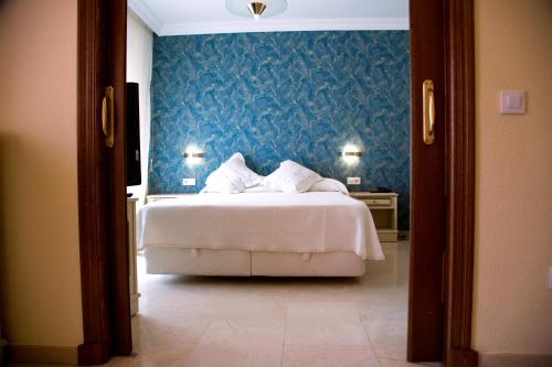 Katil atau katil-katil dalam bilik di Hotel Reina Victoria