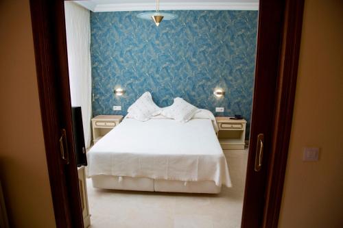 Katil atau katil-katil dalam bilik di Hotel Reina Victoria