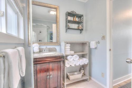 a bathroom with a sink and a mirror at Ohana Shores in Lincoln City