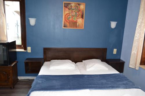 Postel nebo postele na pokoji v ubytování Hotel Plaza