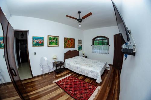 En eller flere senge i et værelse på Fazendinha Nossa Senhora da Medalha Milagrosa